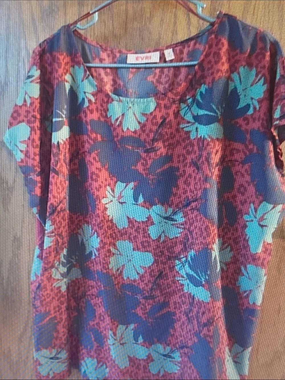 EVRI Teal Floral Short Sleeve Blouse on Magenta Background